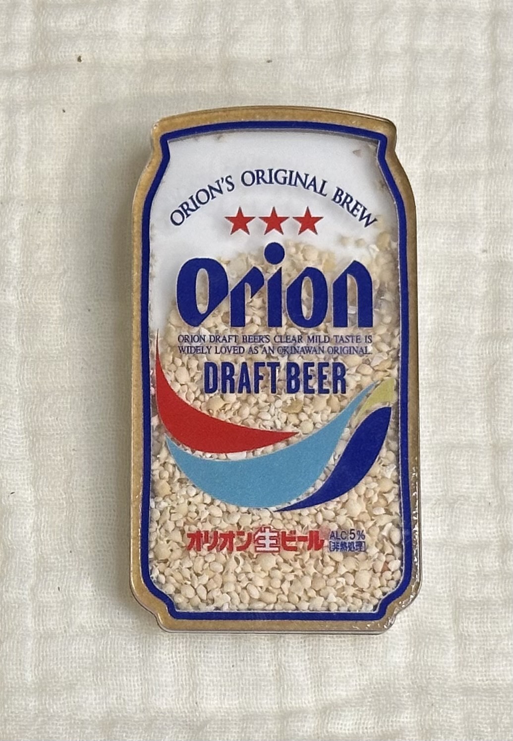 沖縄で購入した、オリオンビール缶をモチーフにした砂入りご当地マグネット